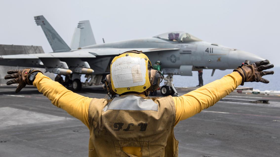 Fighter jet on the deck of an aircraft carrier