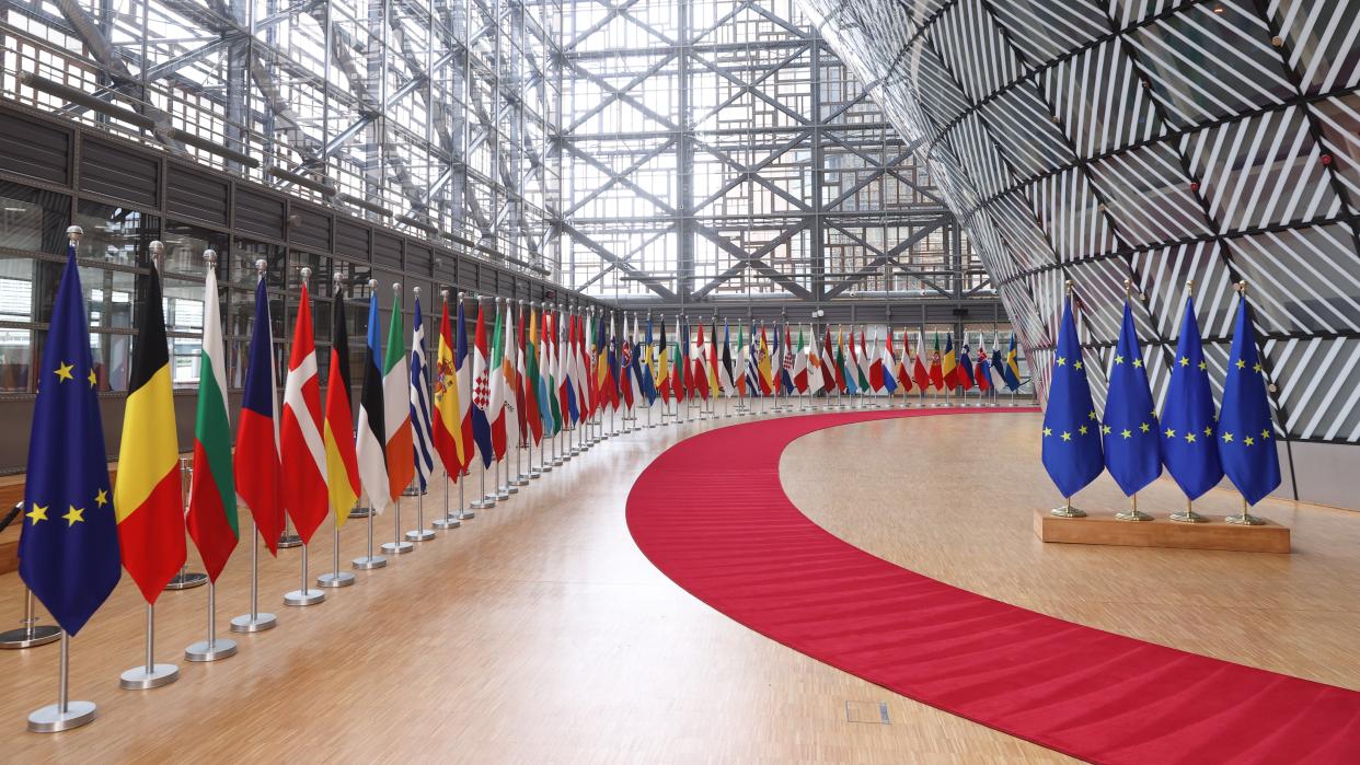Forum of the Europa building in Brussels with EU and world flags
