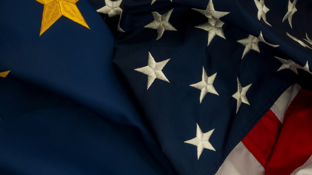 Flags of the US and the EU on top of each other
