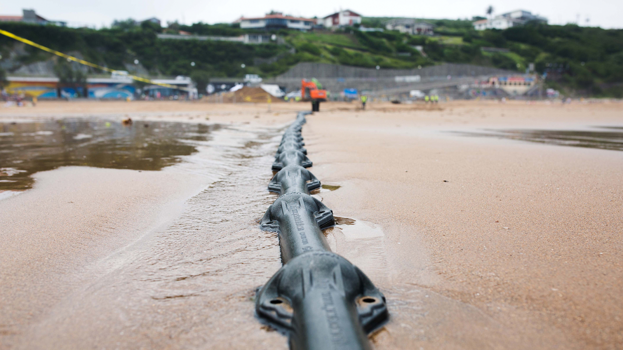 Final installation of Marea transatlantic undersea cable on shore in Bilbao, Spain.