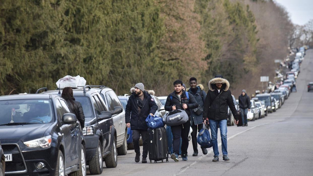 March 1, 2022, Lviv, Ukraine: Foreigners walk to Shehyni checkpoint to cross Ukrainian-Polish border due to Russian aggression.