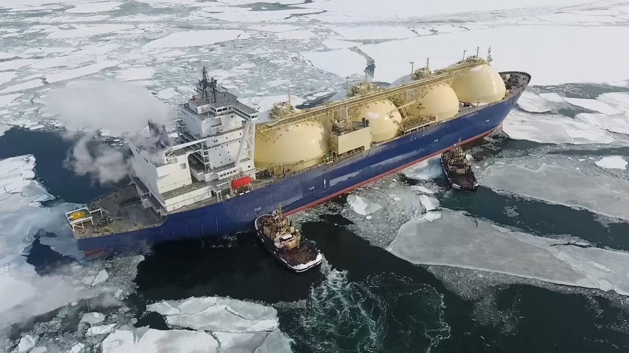 Photo of a liquefied gas tanker being towed in the Arctic Sea