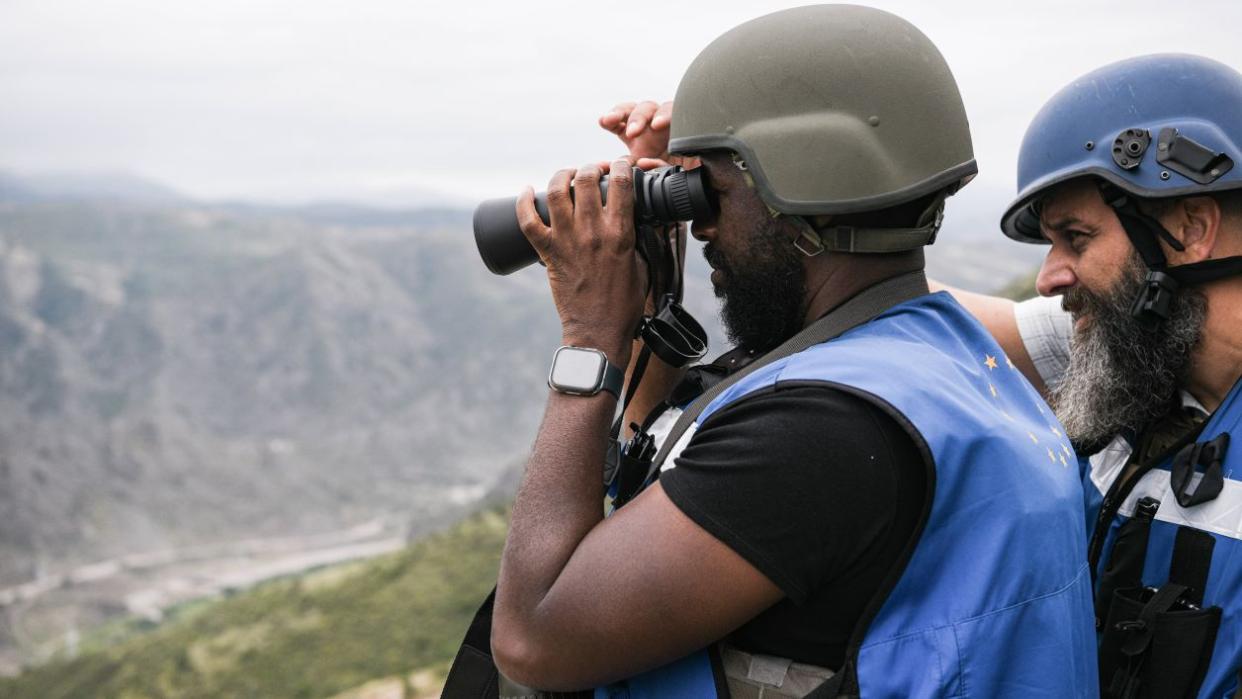 Two Members of the EU observation mission are seen at Hakari Bridge where Azerbaijan set up a checkpoint at the entrance to the Lachin Corridor.