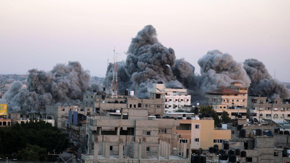 Smoke plumes rising above buildings during an Israeli strike on Rafah in the Gaza Strip, Saturday October 15, 2023.