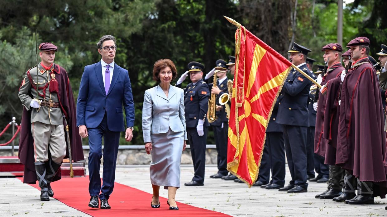 North Macedonian President-elect Gordana Siljanovska Davkova (3rd L) and outgoing President Stevo Pendarovski (2nd L) review the guard of honor in Skopje, North Macedonia, May 12, 2024