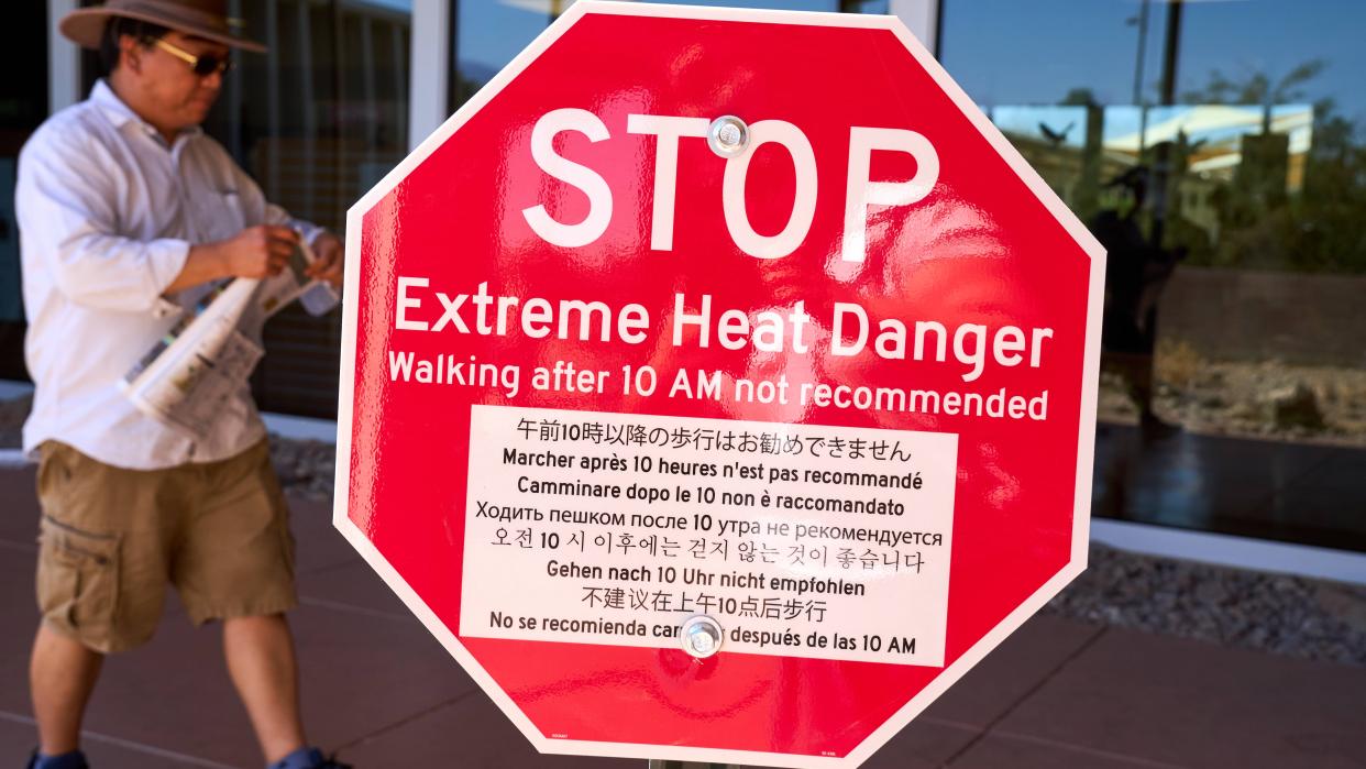 Sign warns visitors of the dangers of extreme heat at Death Valley National Park