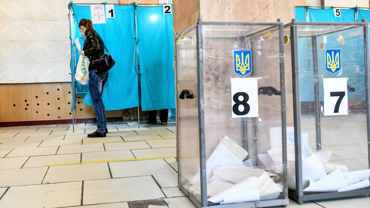 Transparent ballot boxes are installed at a polling station in Ukraine