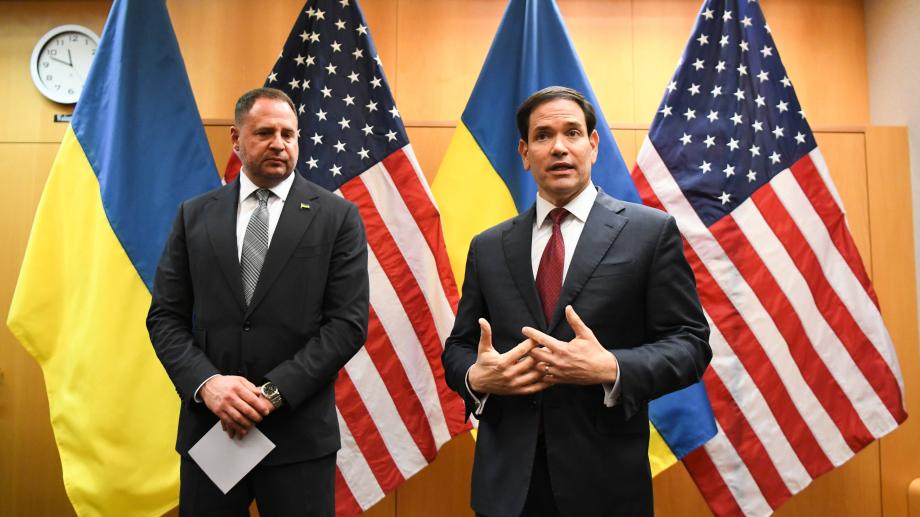 US Secretary of State Marco Rubio speaks during a press briefing at the United States Mission to the United Nations and Other International Organizations in Geneva, Switzerland, Nov. 23, 2025 with US and Ukraine flags in background