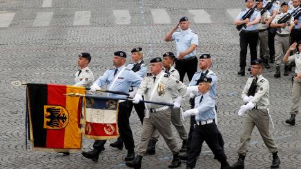 Soldiers of the Franco-German Brigade march during the traditional Bastille Day military parade on the Champs-Elysees Avenue in Paris, France, July 14, 2019.