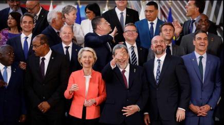 Saint Vincent and the Grenadines Prime Minister Ralph Gonsalves, European Commission President Ursula von der Leyen, German Chancellor Olaf Scholz, Finland's Prime Minister Petteri Orpo, Spain's Prime Minister Pedro Sanchez, President of the European Council Charles Michel, French President Emmanuel Macron, Antigua and Barbuda Prime Minister Gaston Alfonso Browne react as Leaders of the European Union (EU) and the Community of Latin American and Caribbean States (CELAC) pose for a family photo.