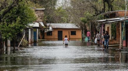 People standing in a looded street