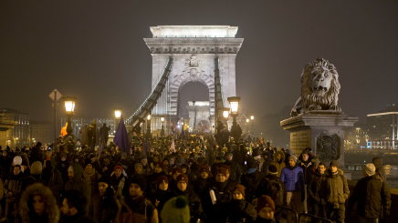 Thousands of protesters walk down Budapest’s famed Chain Bridge during an anti-government march in central Budapest, Hungary, Friday, Dec. 21, 2018.