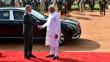 Indian Prime Minister Narendra Modi (R, front) greets German Chancellor Olaf Scholz during a ceremonial reception at Indian Presidential Palace in New Delhi, Feb. 25, 2023