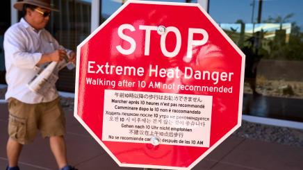 Sign warns visitors of the dangers of extreme heat at Death Valley National Park