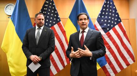 US Secretary of State Marco Rubio speaks during a press briefing at the United States Mission to the United Nations and Other International Organizations in Geneva, Switzerland, Nov. 23, 2025 with US and Ukraine flags in background