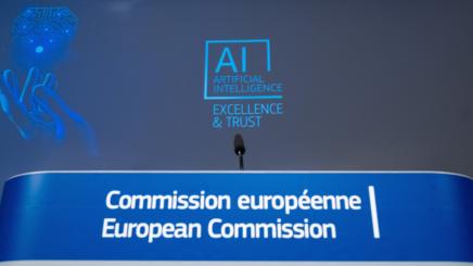 Photo of European Commission presentation with AI logo